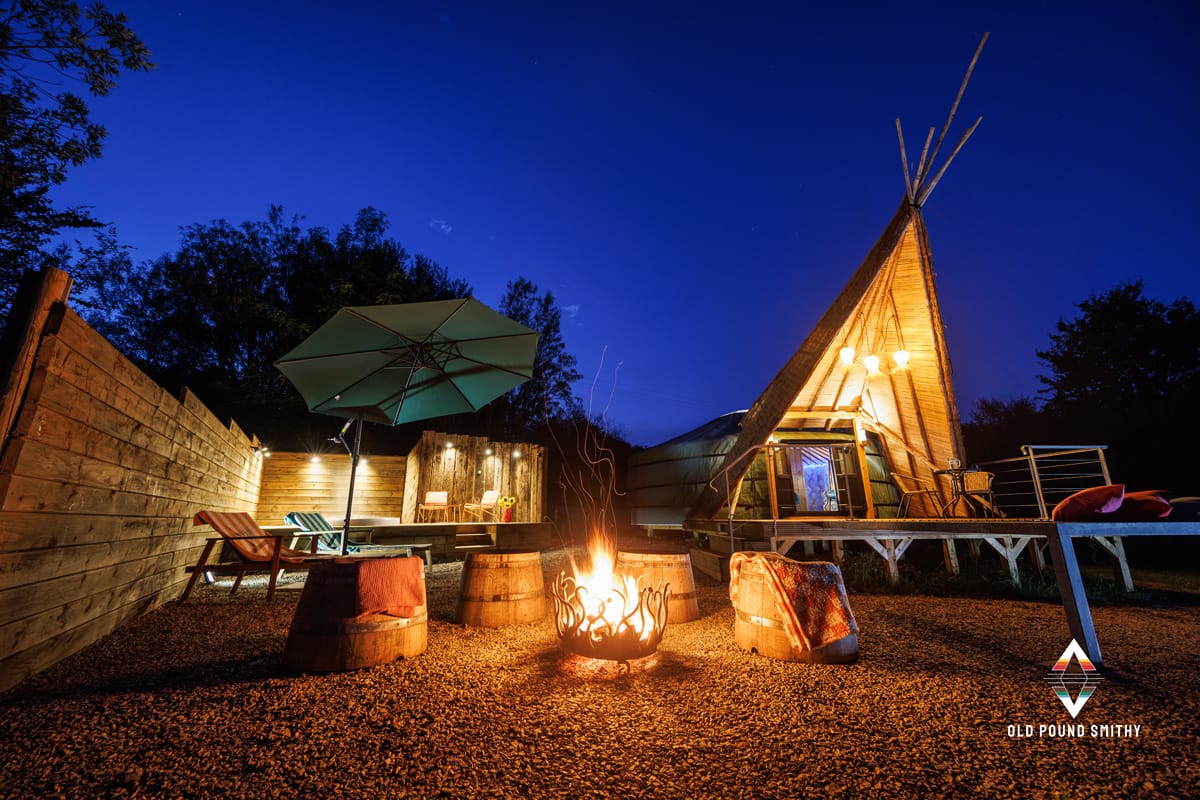 Warm fire pit burning in front of Yurt accommodation at Old Pound Smithy