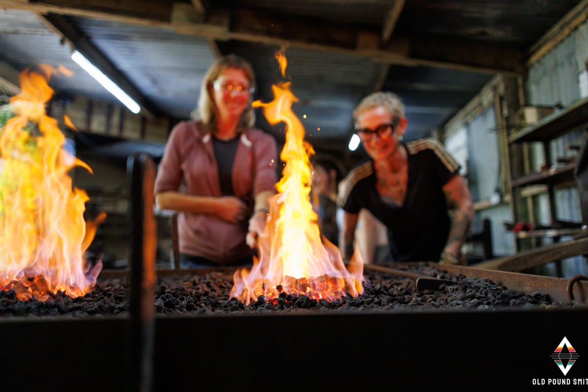 Two ladies doing Traditional blacksmithing at Old Pound Smithy, North Devon”